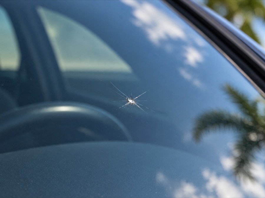 Star-shaped rock chip on a car windshield