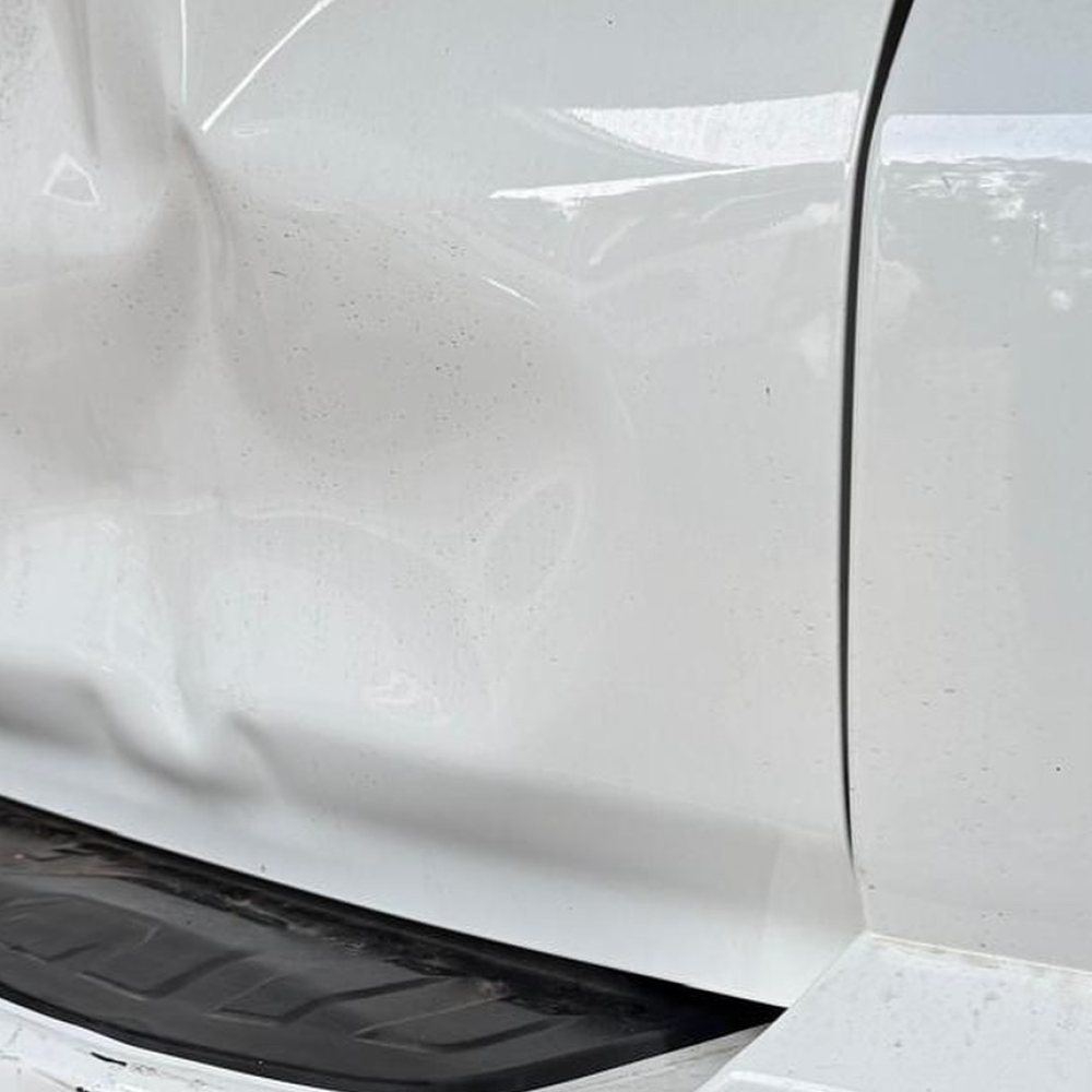 Before: Tailgate Dent